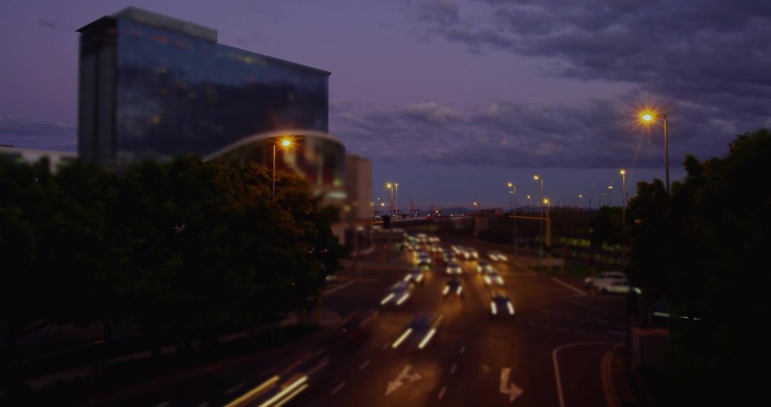 Transport Motion Blur with Streetlight Glow at Dusk in Urban Setting