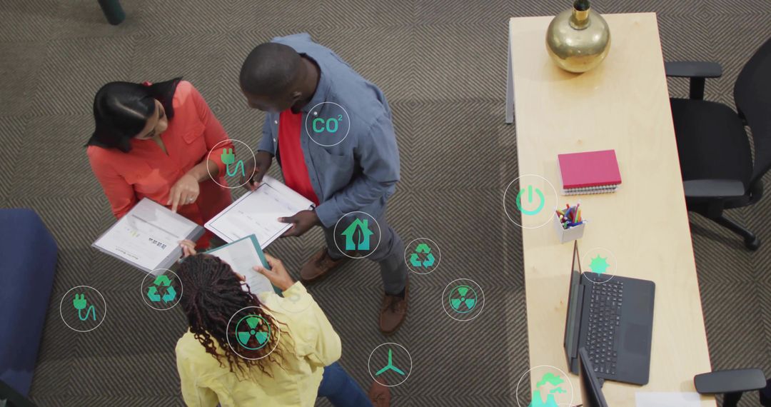 Diverse Team Discussing Sustainable Development with Eco Icons