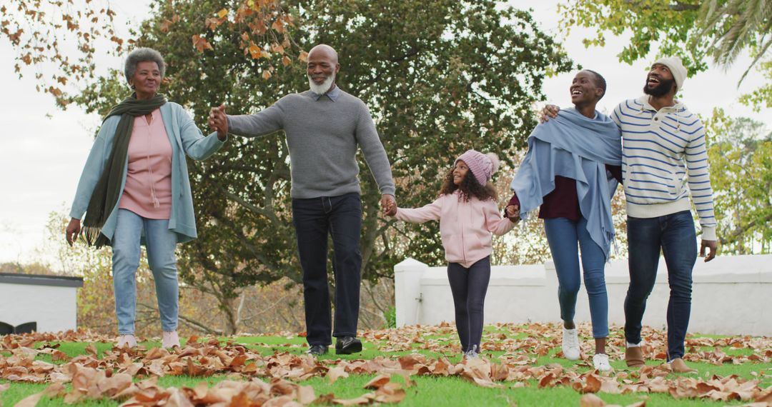 Multigenerational Family Enjoying Autumn Walk Outdoors - Free Images, Stock Photos and Pictures on Pikwizard.com