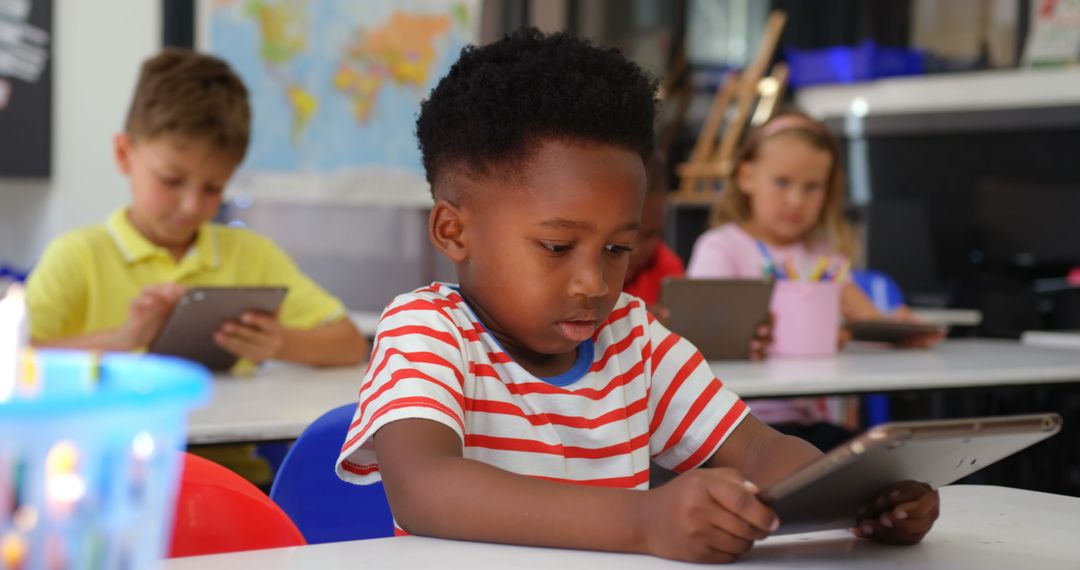 Children Engaged with Technology in Classroom Environment