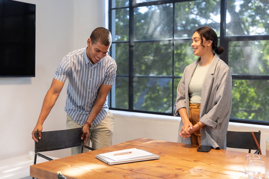 Diverse Coworkers Collaborating by Conference Table