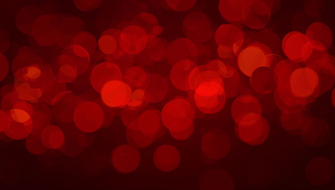 Glowing red bokeh background with layered translucent discs and soft burgundy radial glow