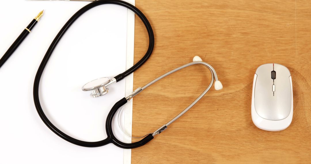 Stethoscope and Mouse on Wooden Desk Signifying Medical Technology - Free Images, Stock Photos and Pictures on Pikwizard.com