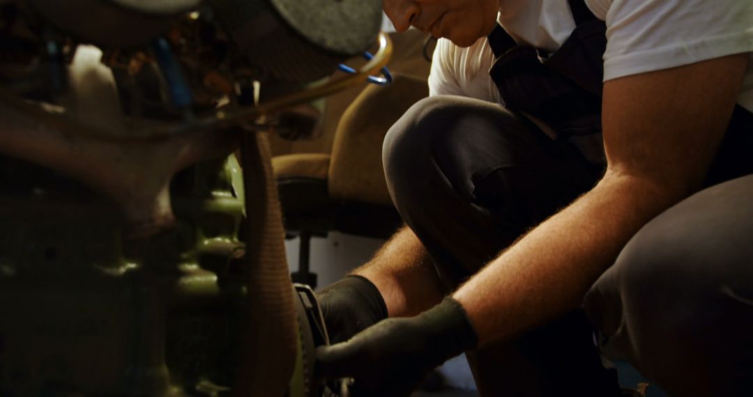 Mechanic Repairing Engine in Workshop Close-Up Shot - Free Images, Stock Photos and Pictures on Pikwizard.com