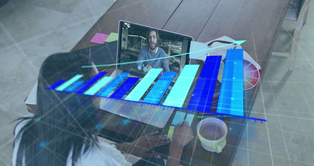 Designer Analyzing Holographic Bar Chart in Home Office