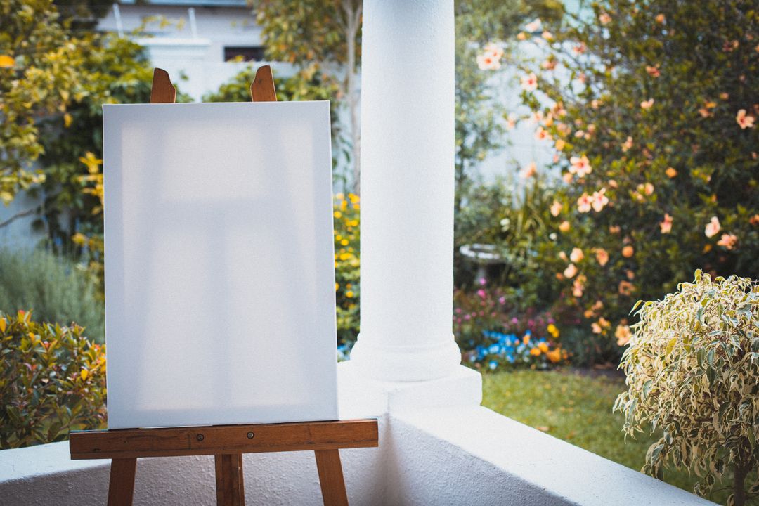 Blank Canvas on Easel in Summer Garden Terrace - Free Images, Stock Photos and Pictures on Pikwizard.com