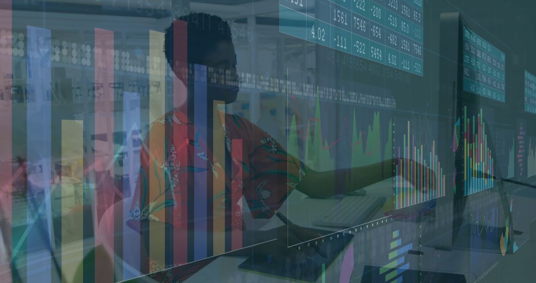 Data Analyst Working with Digital Charts on Monitors in Office