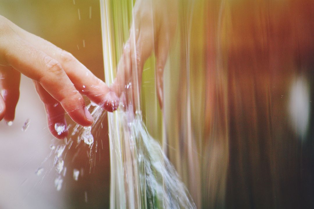 Child's Hand Splashing in Stream of Water - Free Images, Stock Photos and Pictures on Pikwizard.com