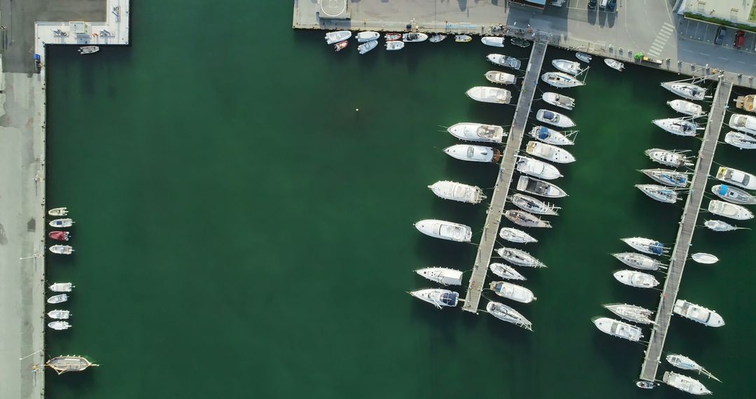 Aerial View of Boats Docked in Marina Near City Waterfront - Free Images, Stock Photos and Pictures on Pikwizard.com