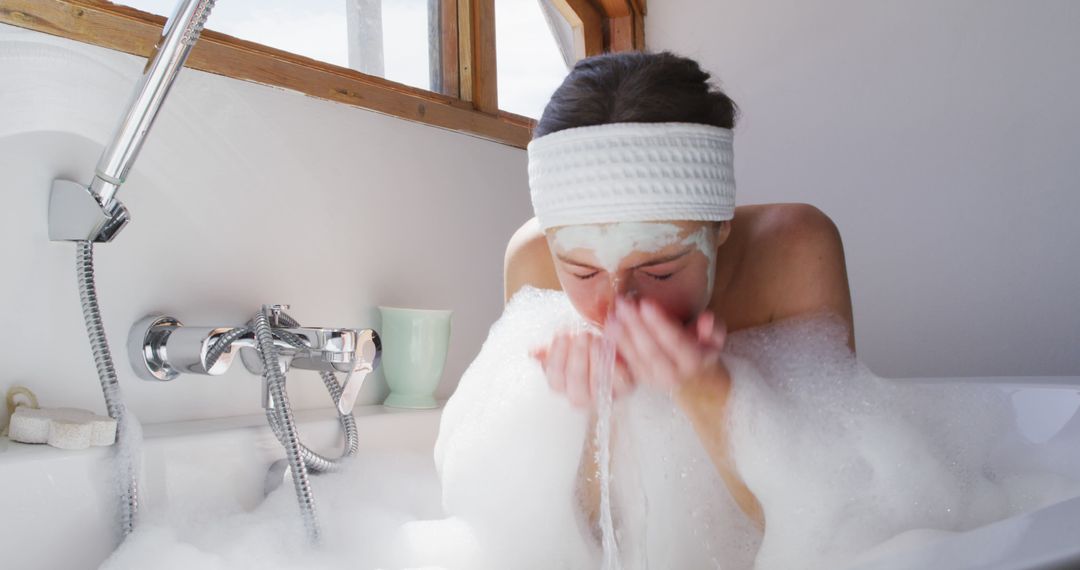 Relaxing Woman Washing Face in Bubble Bath at Home - Free Images, Stock Photos and Pictures on Pikwizard.com