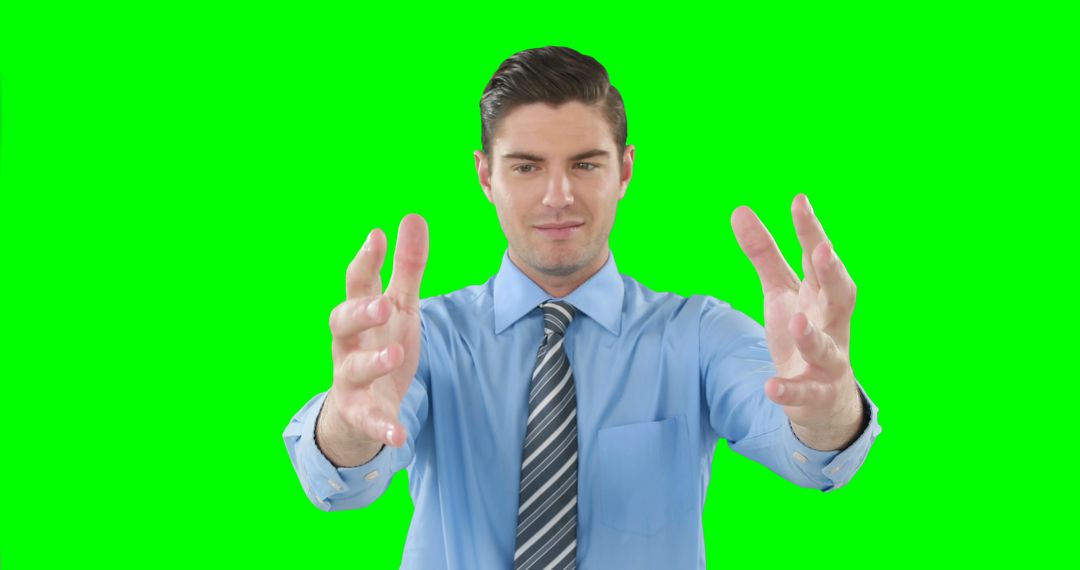 Businessman in Blue Shirt and Tie Reaching Out Hands, Green Screen Background - Free Images, Stock Photos and Pictures on Pikwizard.com