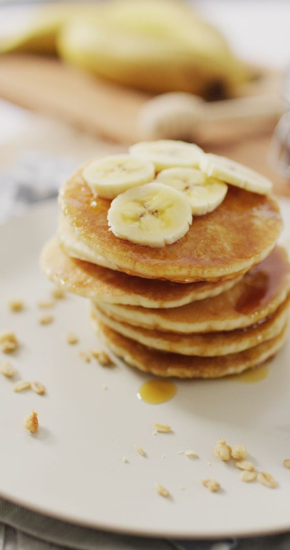 Delicious Pancakes Stack Topped with Sliced Bananas