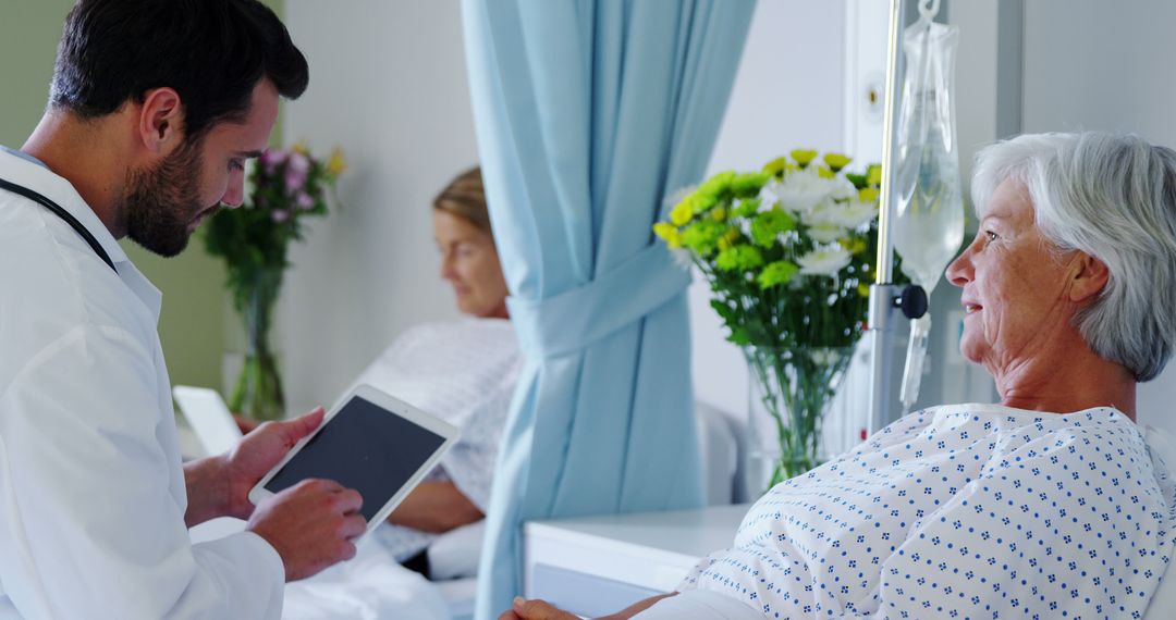 Doctor Using Digital Tablet with Senior Patient in Hospital - Free Images, Stock Photos and Pictures on Pikwizard.com