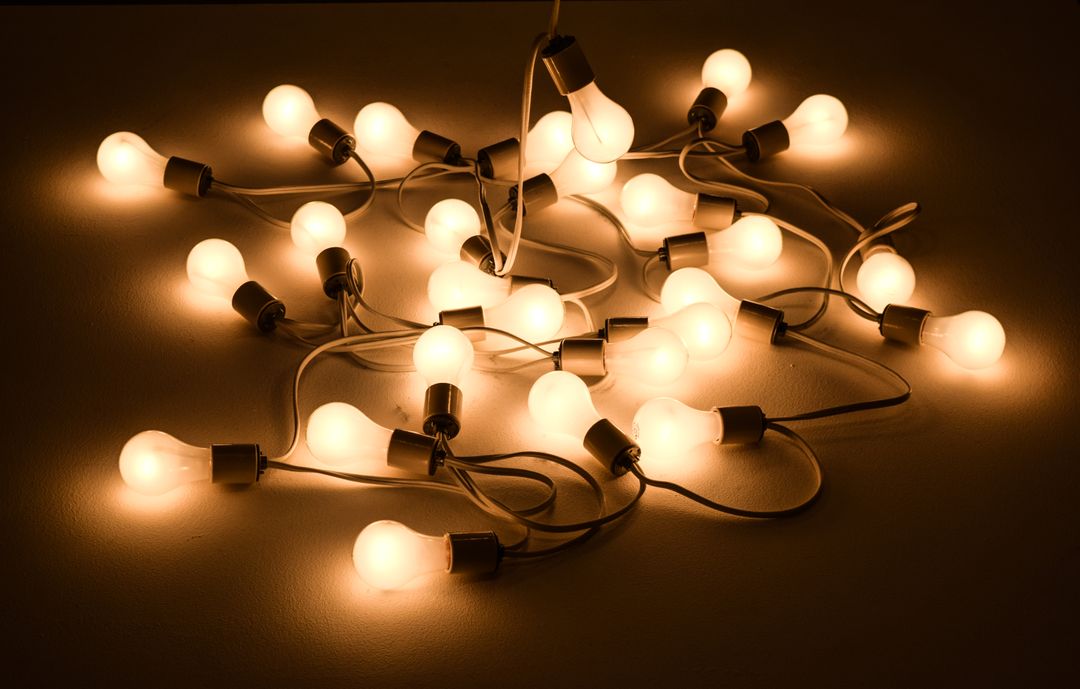 Warm Glowing Light Bulbs in a Tangled Arrangement - Free Images, Stock Photos and Pictures on Pikwizard.com