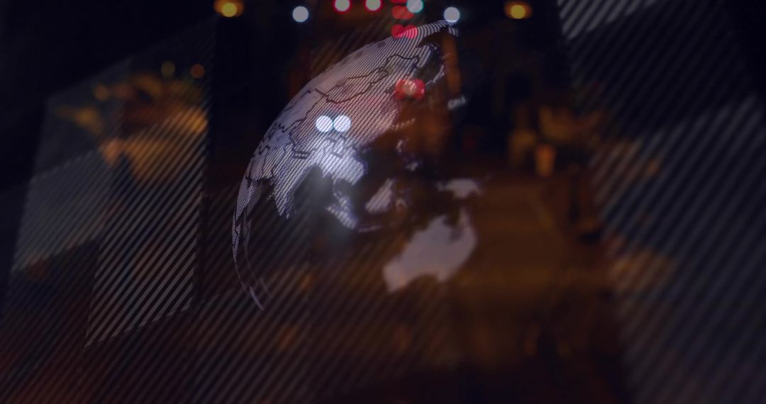 Translucent Globe Projection Over Urban Night Street Showing Asia Australia Map and Bokeh