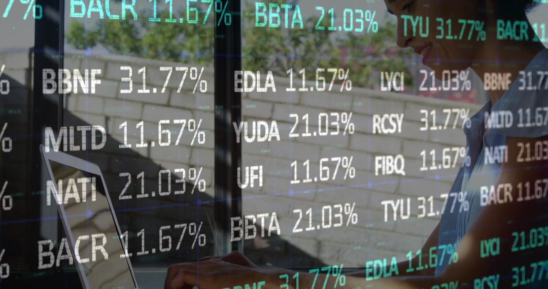 Businesswoman Analyzing Data with Laptop and Overlayed Financial Statistics