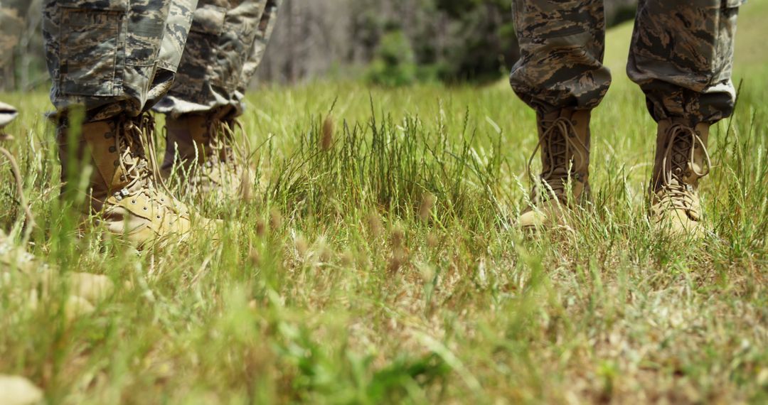 Military Personnel in Camouflage Uniforms Standing in Field - Free Images, Stock Photos and Pictures on Pikwizard.com