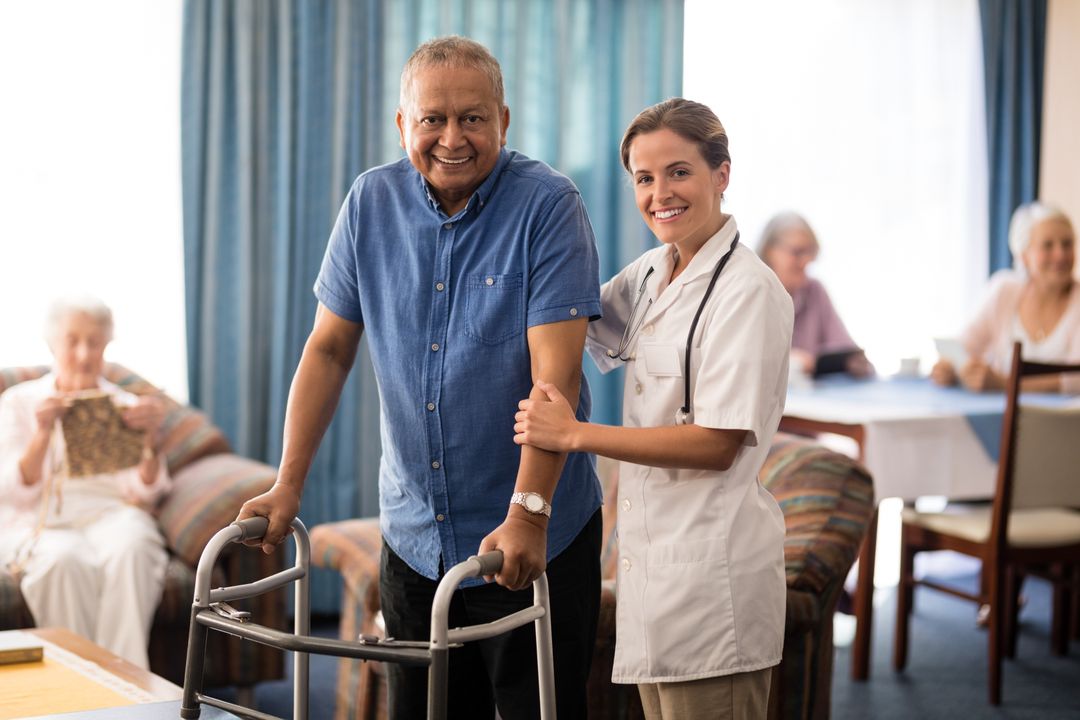 Smiling Nurse Assisting Senior Man with Walker in Retirement Home - Free Images, Stock Photos and Pictures on Pikwizard.com