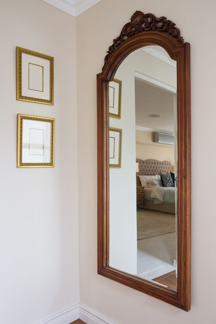 Elegant Wooden Framed Mirror on Wall in Home Interior - Free Images, Stock Photos and Pictures on Pikwizard.com