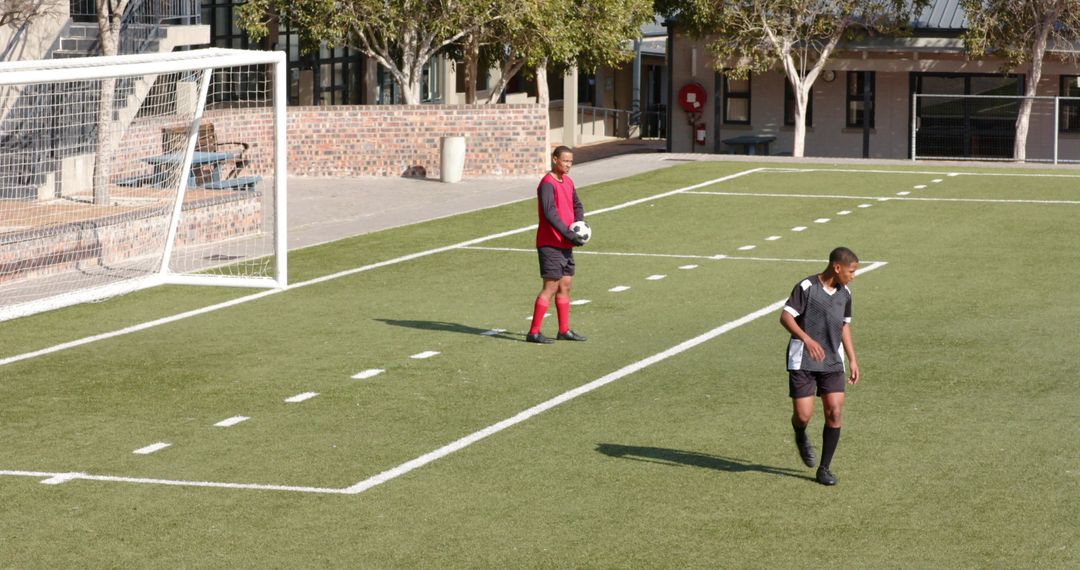 Soccer Players Preparing with Determination on Training Field