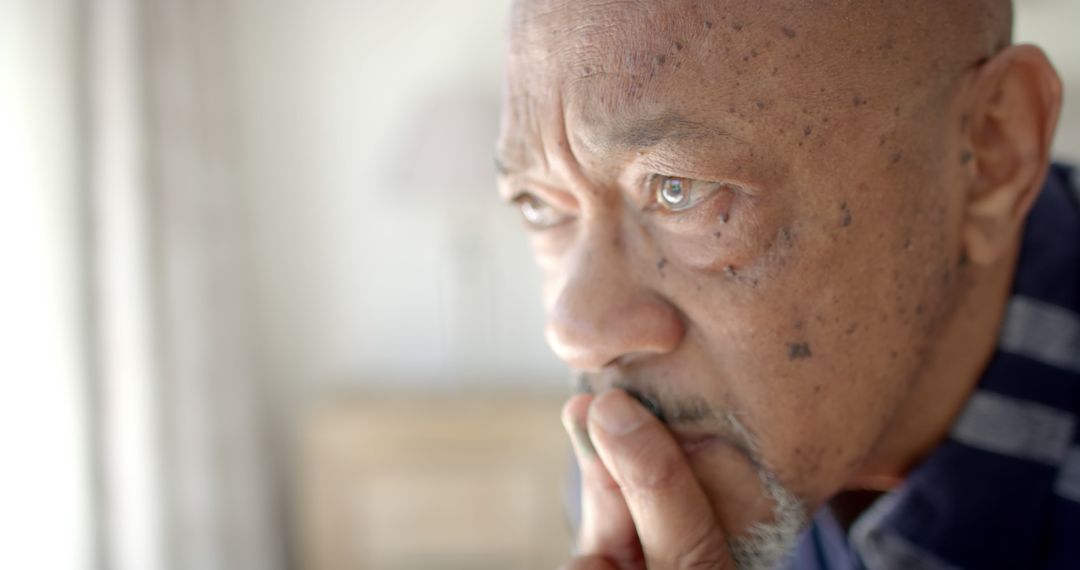 Elderly Man Deep in Thought Staring Out Window - Free Images, Stock Photos and Pictures on Pikwizard.com