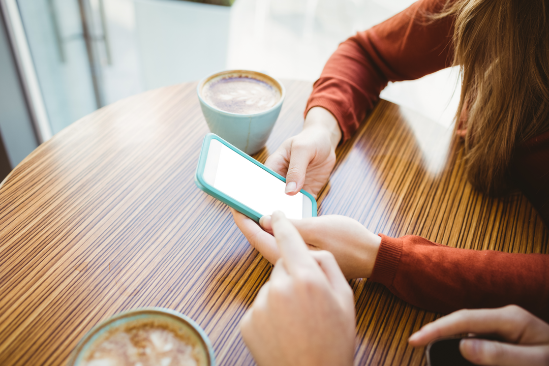 Women Messaging on Smartphone at Cozy Cafe with Latte Cups Transparent Table - Download Free Stock Images Pikwizard.com