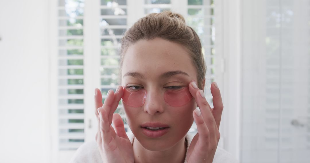 Woman Relaxing with Under-Eye Gel Patches for Skincare Treatment - Free Images, Stock Photos and Pictures on Pikwizard.com