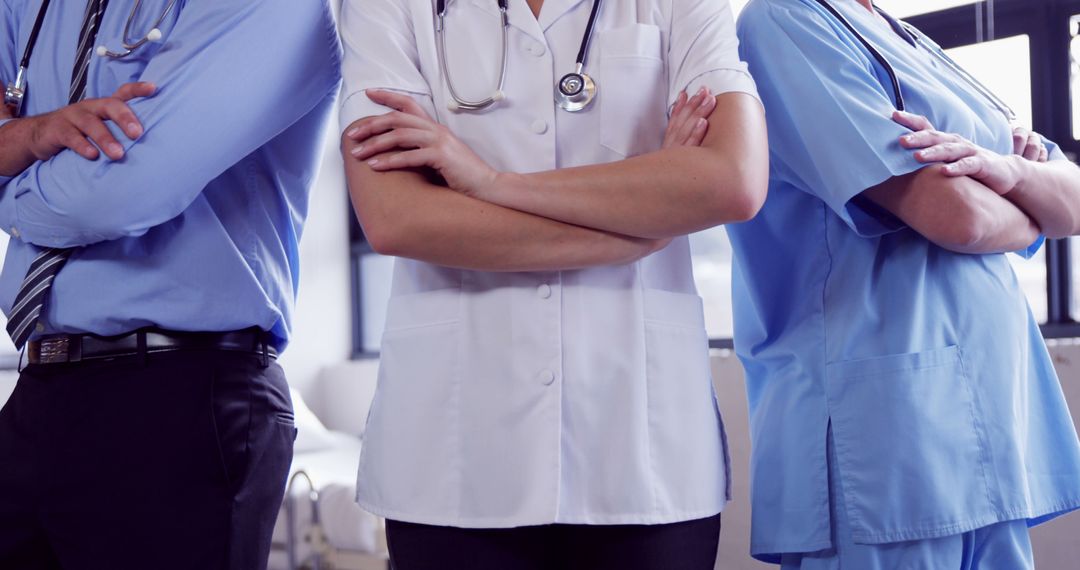 Three Healthcare Professionals Standing with Arms Crossed - Free Images, Stock Photos and Pictures on Pikwizard.com