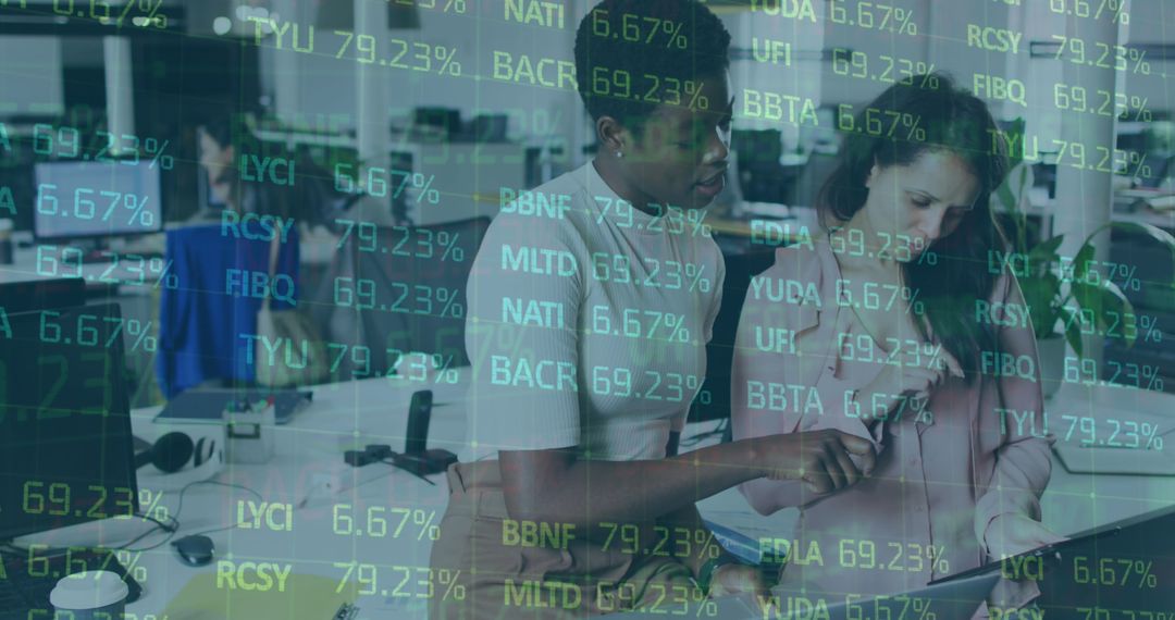 Multiracial Colleagues Analyzing Digital Financial Data in Office