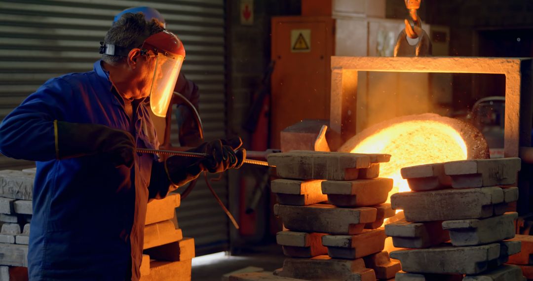 Skilled Technician Pouring Molten Metal in Industrial Foundry - Free Images, Stock Photos and Pictures on Pikwizard.com