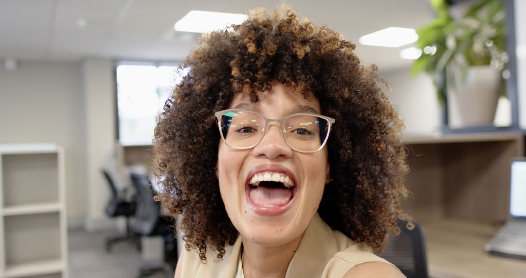 Joyful Professional Woman in Modern Workspace Smiling Brightly