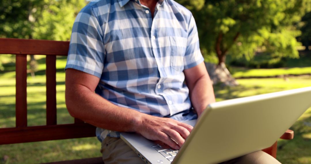 Senior Man Typing on Laptop Outdoors - Free Images, Stock Photos and Pictures on Pikwizard.com