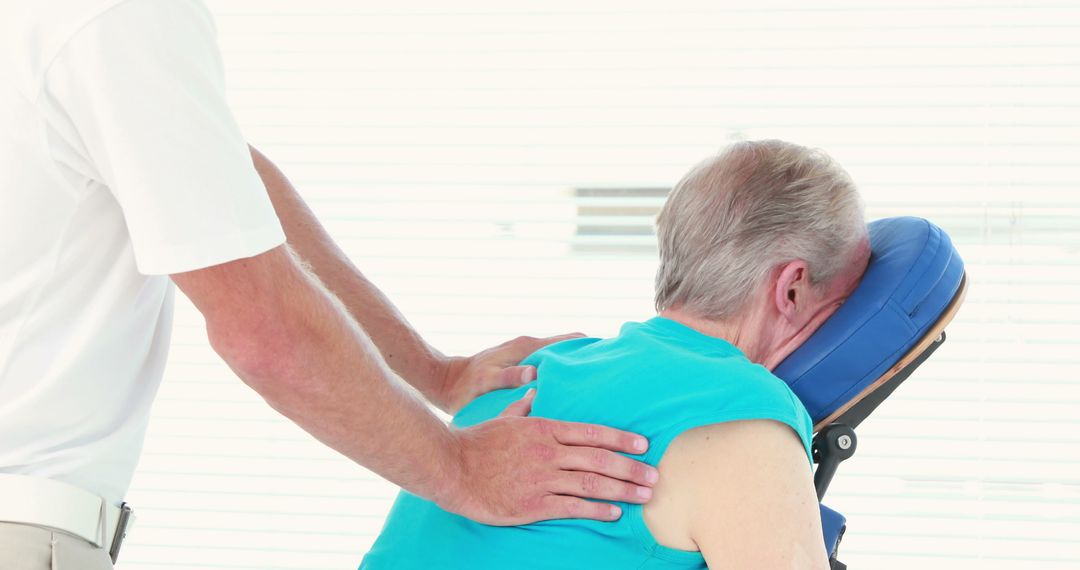 Seated Massage Therapy for Elderly Man - Free Images, Stock Photos and Pictures on Pikwizard.com