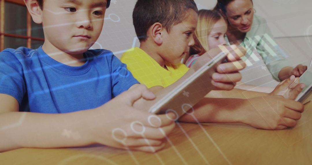 Teacher Assisting Children with Tablets in Digital Classroom Environment