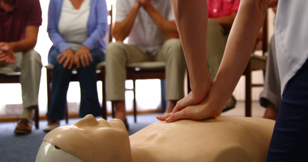 People Learning and Practicing CPR Techniques on Mannequin in Training Class - Free Images, Stock Photos and Pictures on Pikwizard.com