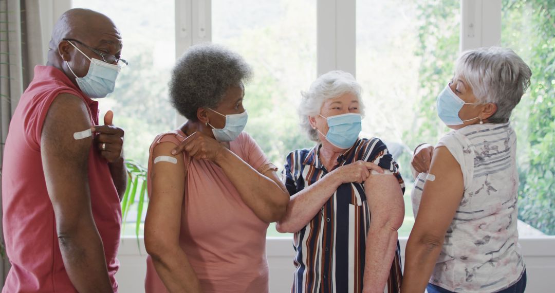 Senior Adults Displaying Vaccination Bandages While Wearing Face Masks - Free Images, Stock Photos and Pictures on Pikwizard.com