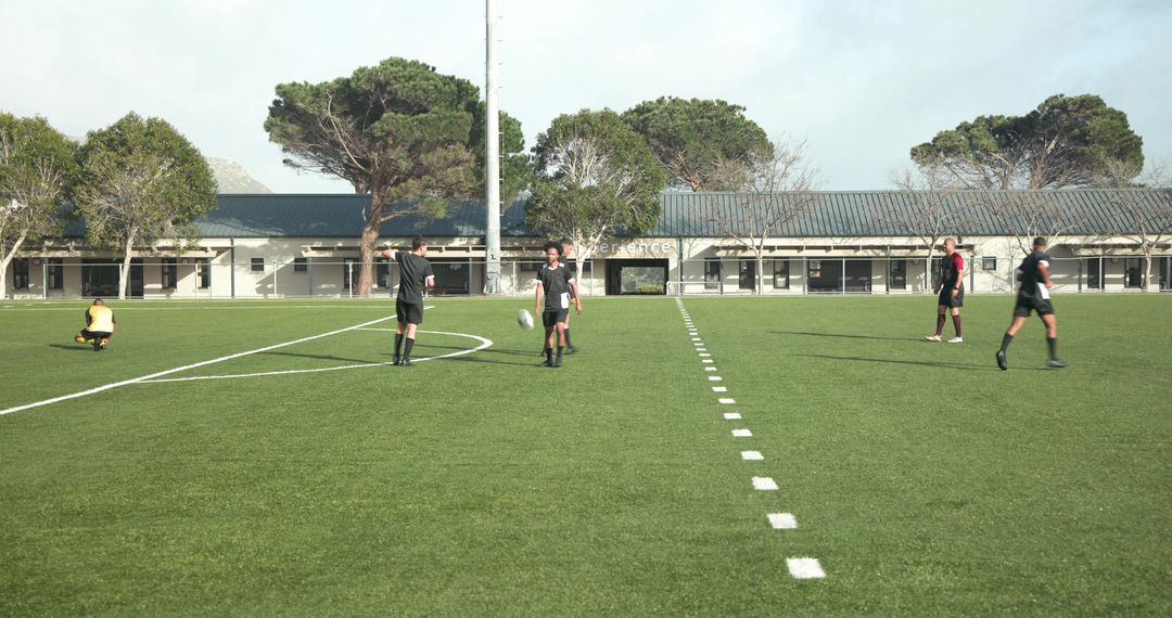 Soccer Team Practice Session on Green Grass Field