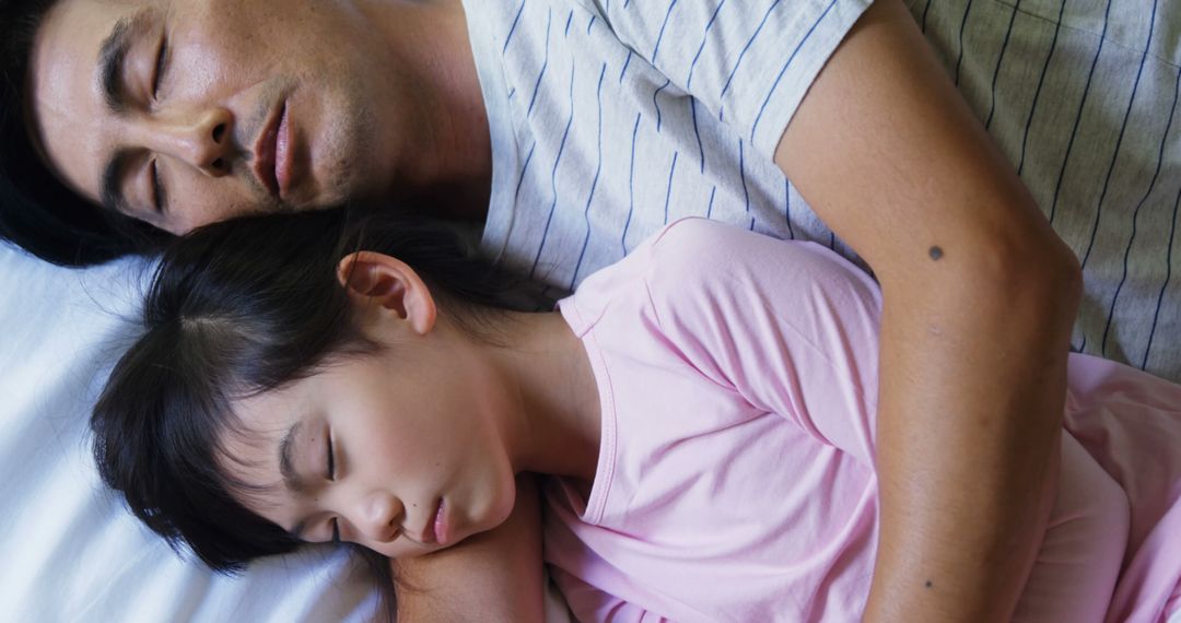 Father Sleeping Peacefully with Daughter in Bed - Free Images, Stock Photos and Pictures on Pikwizard.com