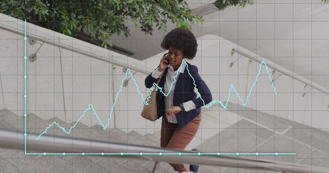 Businesswoman Analyzing Data While Climbing Stairs - Free Images, Stock Photos and Pictures on Pikwizard.com