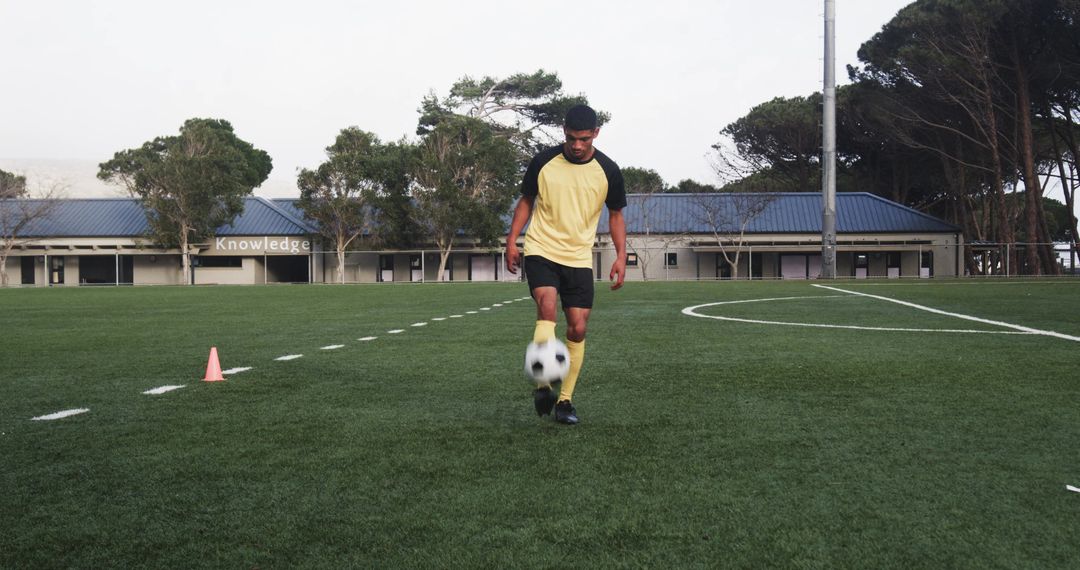 Soccer Player Perfecting Dribbling Skills on Sunny Field
