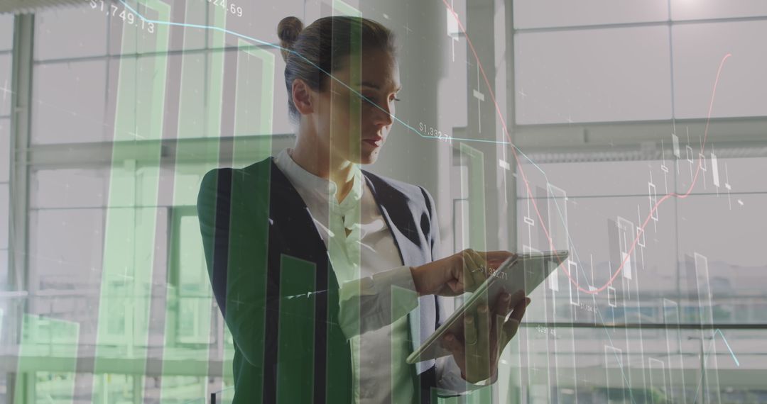 Businesswoman Analyzing Data on Digital Tablet with Economic Graphs Overlay