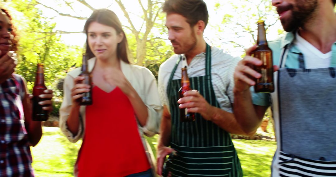 Group of Friends Enjoying Beers in Park on Sunny Day - Free Images, Stock Photos and Pictures on Pikwizard.com