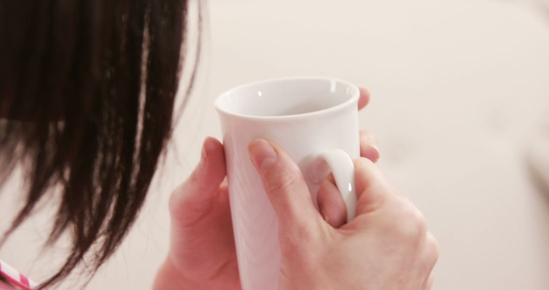 Woman Holding White Mug in Hands Close-Up - Free Images, Stock Photos and Pictures on Pikwizard.com