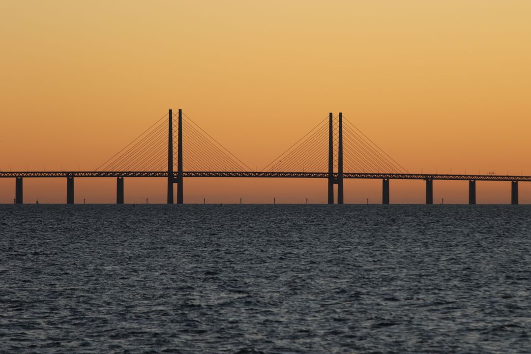 Sunset Over Öresund Bridge Connecting Denmark and Sweden - Free Images, Stock Photos and Pictures on Pikwizard.com