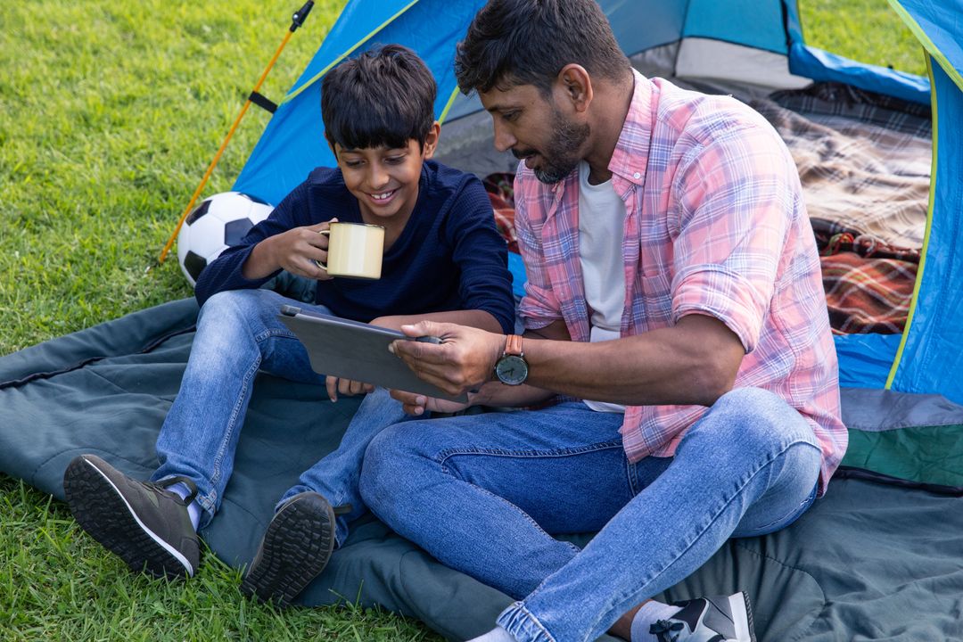 Father Son Duo Enjoys Camping with Technology and Nature