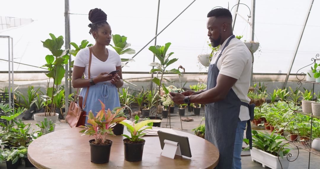 Customer and Locational Owner Engaging in Transaction at Nursery