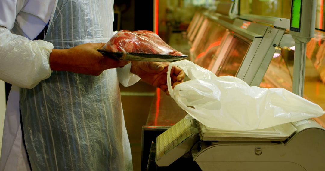 Butcher Weighing Fresh Meat in Modern Grocery Store - Free Images, Stock Photos and Pictures on Pikwizard.com