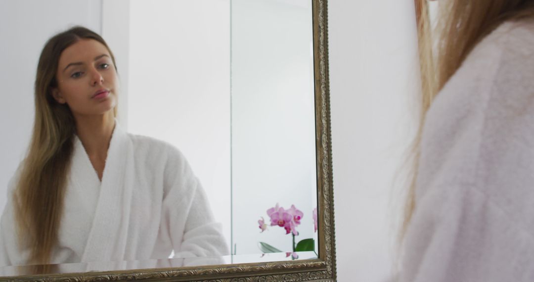 Woman Reflecting in Mirror Wearing Bathrobe at Home - Free Images, Stock Photos and Pictures on Pikwizard.com