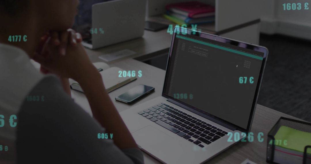 Developer Analyzing Code on Reflective Laptop Screen at Modern Workspace
