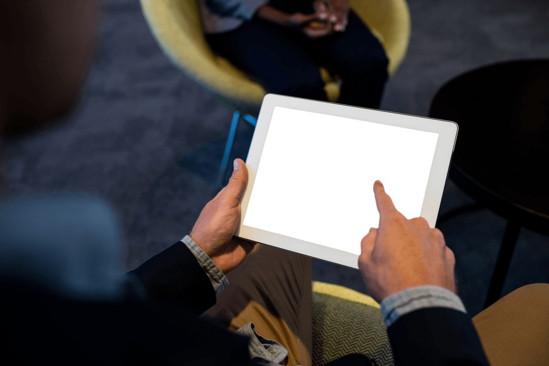 Businessman Using Transparent Digital Tablet in Office Environment